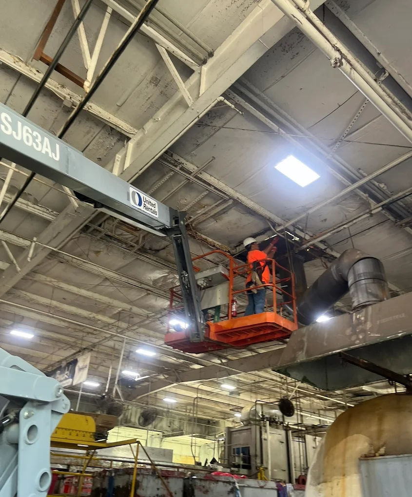 Commercial electrical work on a scissor lift
